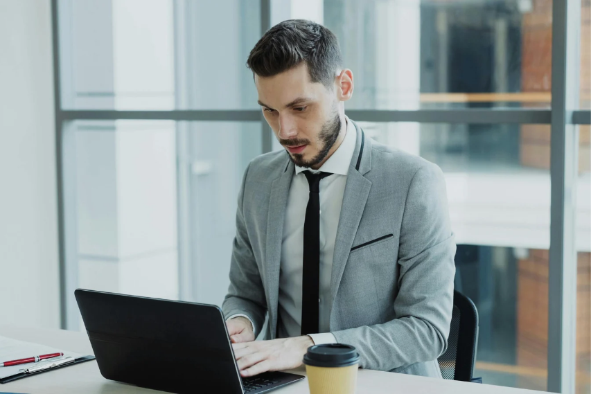 Professional Man Working on Laptop in Office